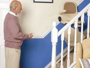 Man looking at stairlift