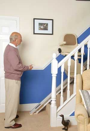 Man stood up looking at stair lift