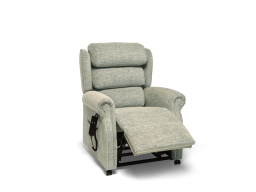 Sand coloured Rise and recliner chair with legs halfway out