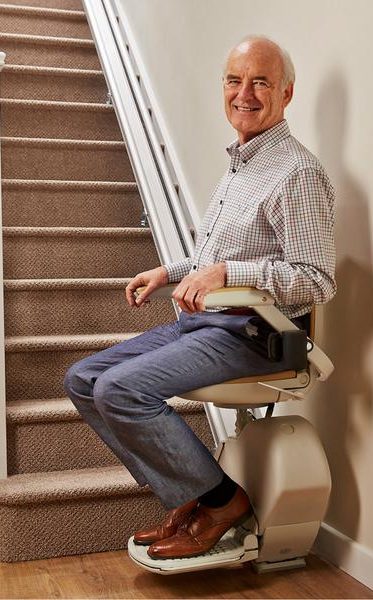 Man stood up looking at stair lift